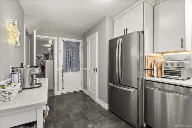 a kitchen with stainless steel appliances a refrigerator and a sink
