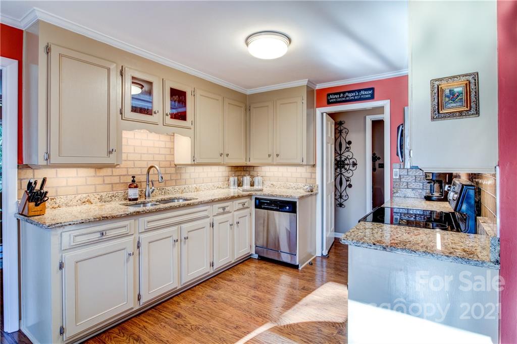 9224 State Rd S-29-624 Indian Land, SC 29707 - Photo 13 of 48 a kitchen with stainless steel appliances granite countertop a sink and cabinets