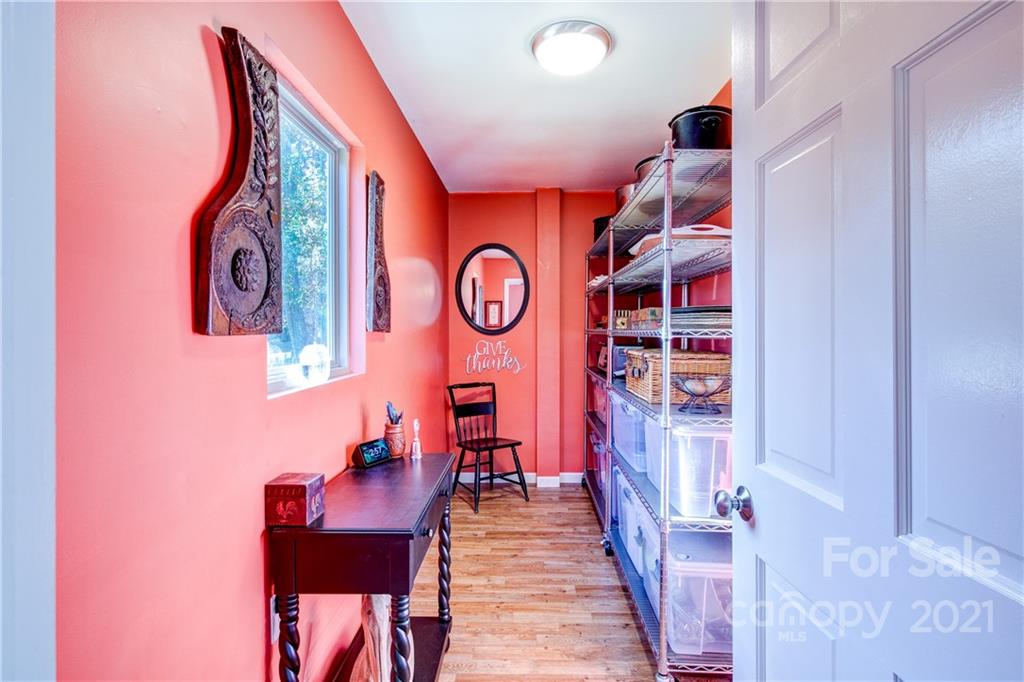 9224 State Rd S-29-624 Indian Land, SC 29707 - Photo 15 of 48 a view of a hallway with seating area and cabinets
