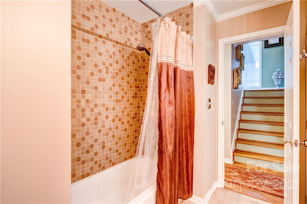 9224 State Rd S-29-624 Indian Land, SC 29707 - Photo 17 of 48 a view of a bathroom with shower and stairs