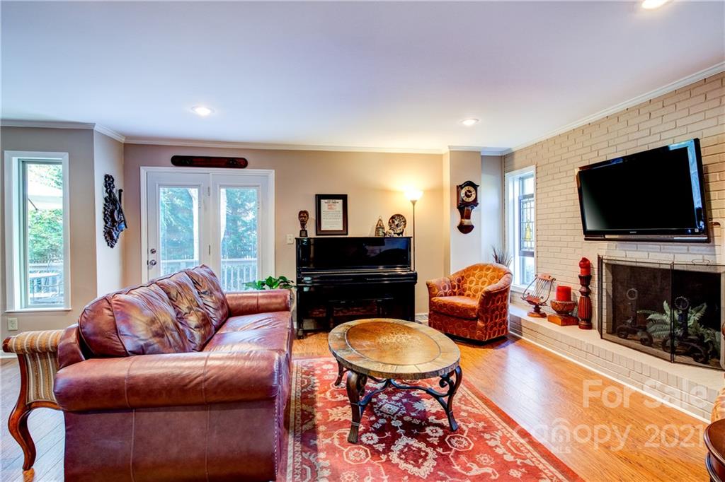9224 State Rd S-29-624 Indian Land, SC 29707 - Photo 8 of 48 a living room with furniture a fireplace and a flat screen tv