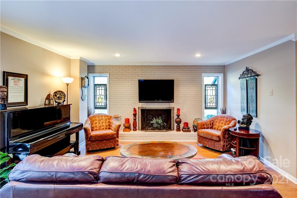 9224 State Rd S-29-624 Indian Land, SC 29707 - Photo 9 of 48 a living room with furniture a flat screen tv and a fireplace