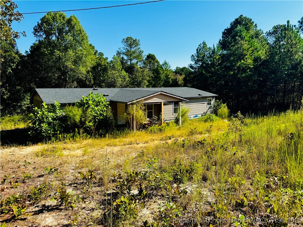 a backyard of a house with lots of green space
