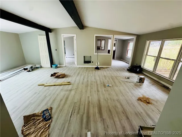 a view of a living room and bathroom