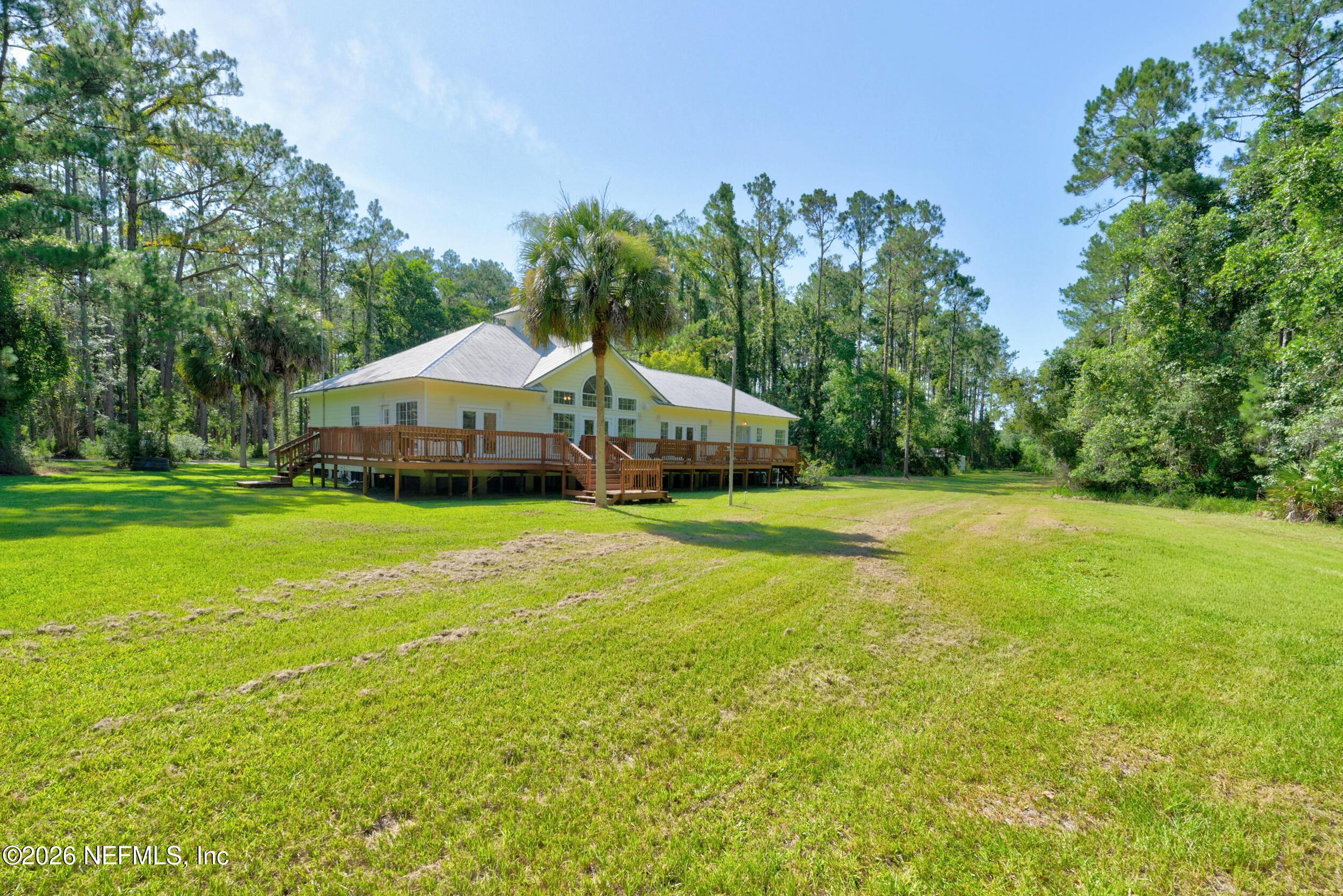 3090 Monument Bay Road St. Augustine, FL 32092 - Photo 47 of 56 a front view of a house with garden