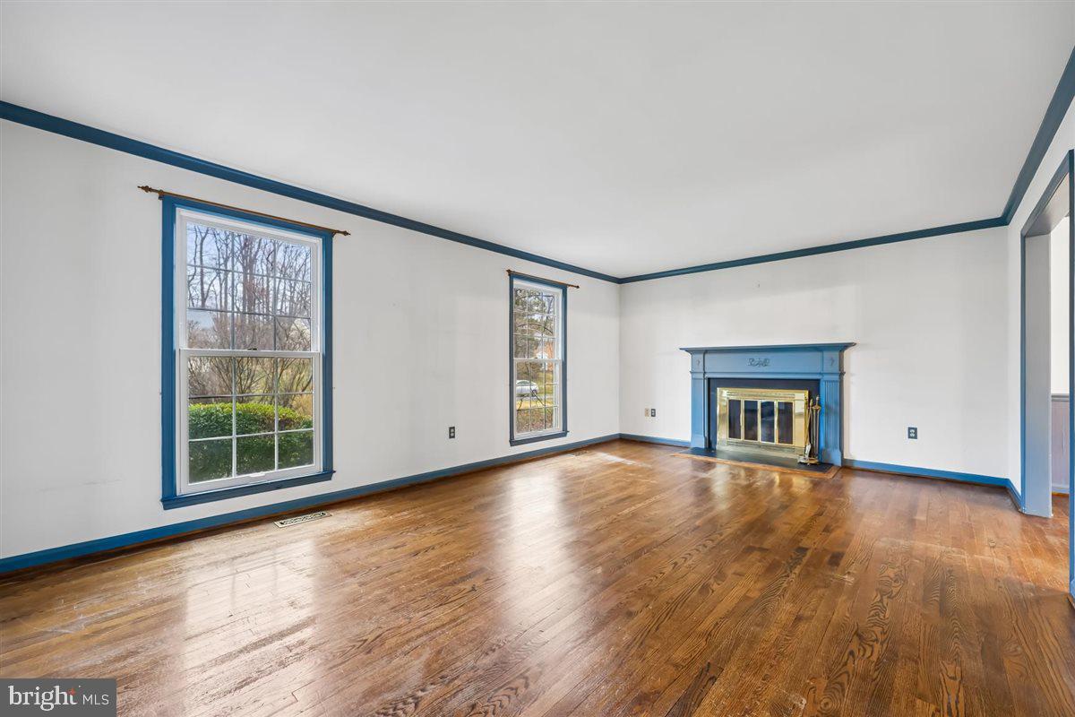 13724 Bridgewater Drive Silver Spring, MD 20904 - Photo 12 of 99 a view of an empty room with wooden floor and a window