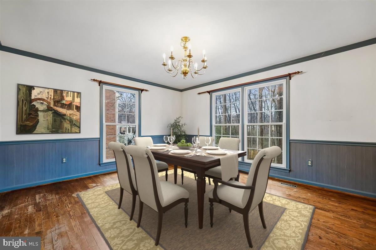 13724 Bridgewater Drive Silver Spring, MD 20904 - Photo 17 of 99 a view of a dining room with furniture a chandelier and wooden floor