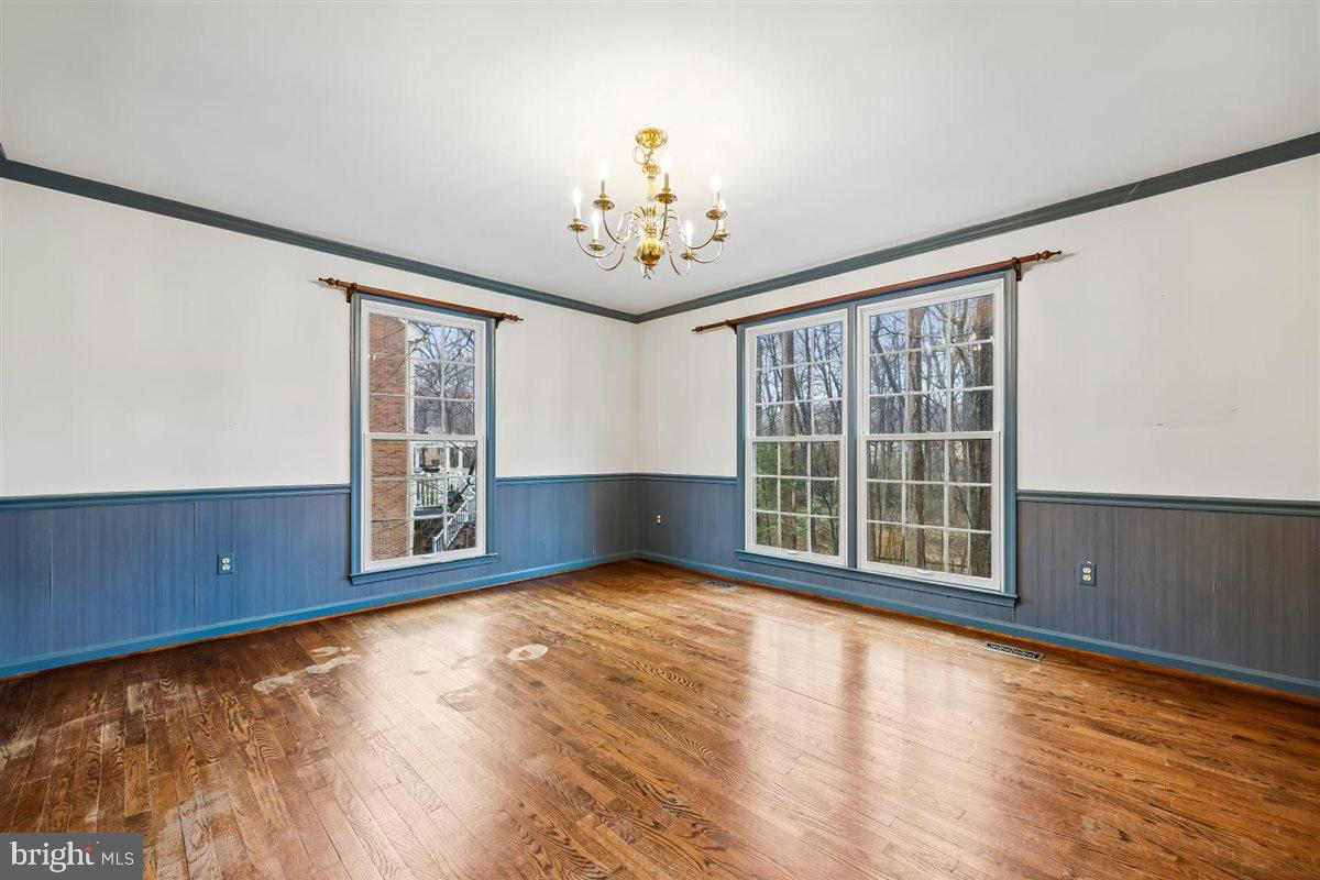 13724 Bridgewater Drive Silver Spring, MD 20904 - Photo 18 of 99 a view of an empty room with a window and wooden floor