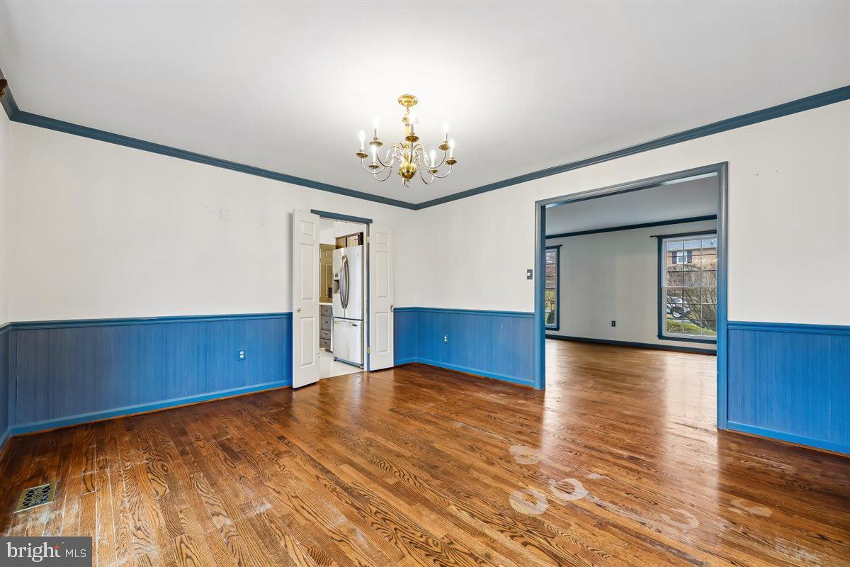 13724 Bridgewater Drive Silver Spring, MD 20904 - Photo 20 of 99 a view of empty room with wooden floor and fan