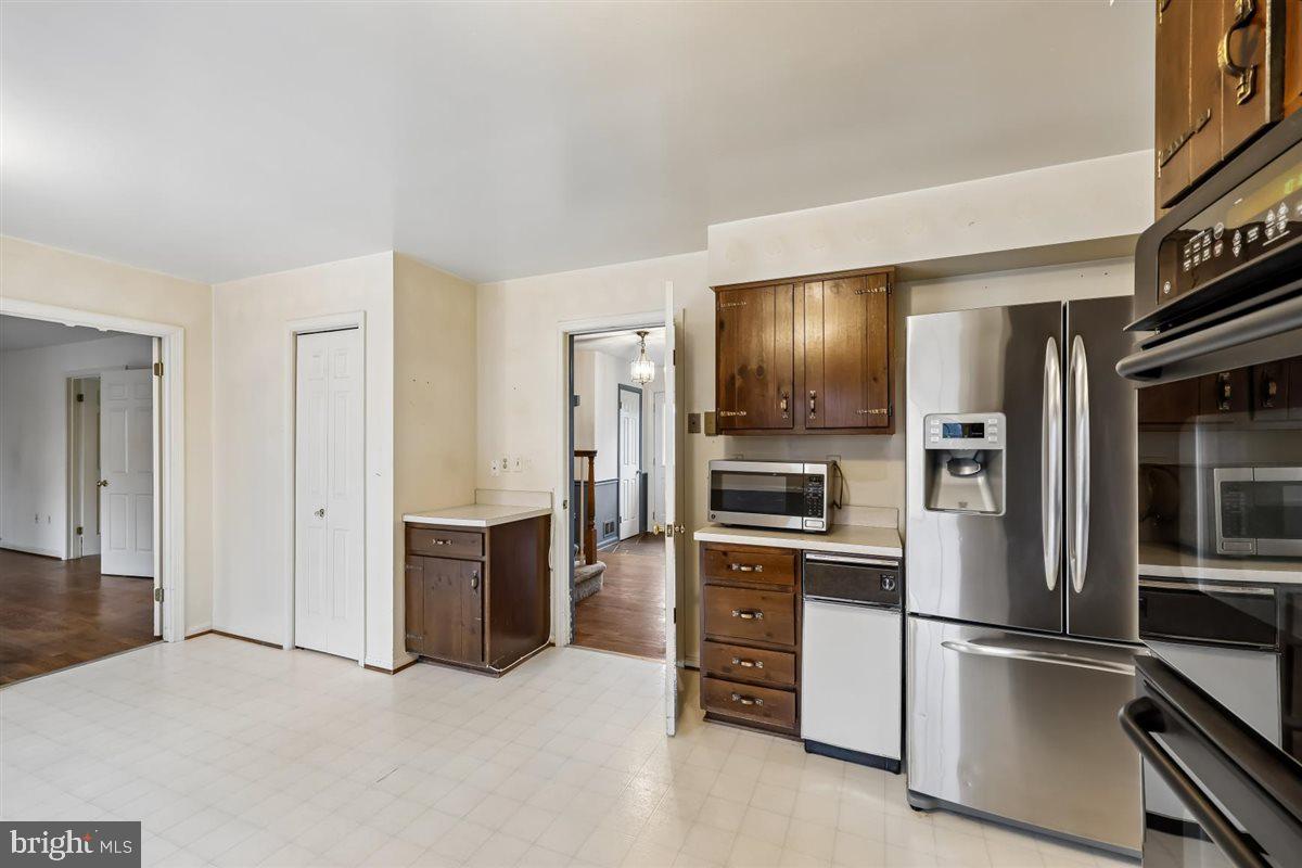 13724 Bridgewater Drive Silver Spring, MD 20904 - Photo 24 of 99 a kitchen with stainless steel appliances a refrigerator and stove