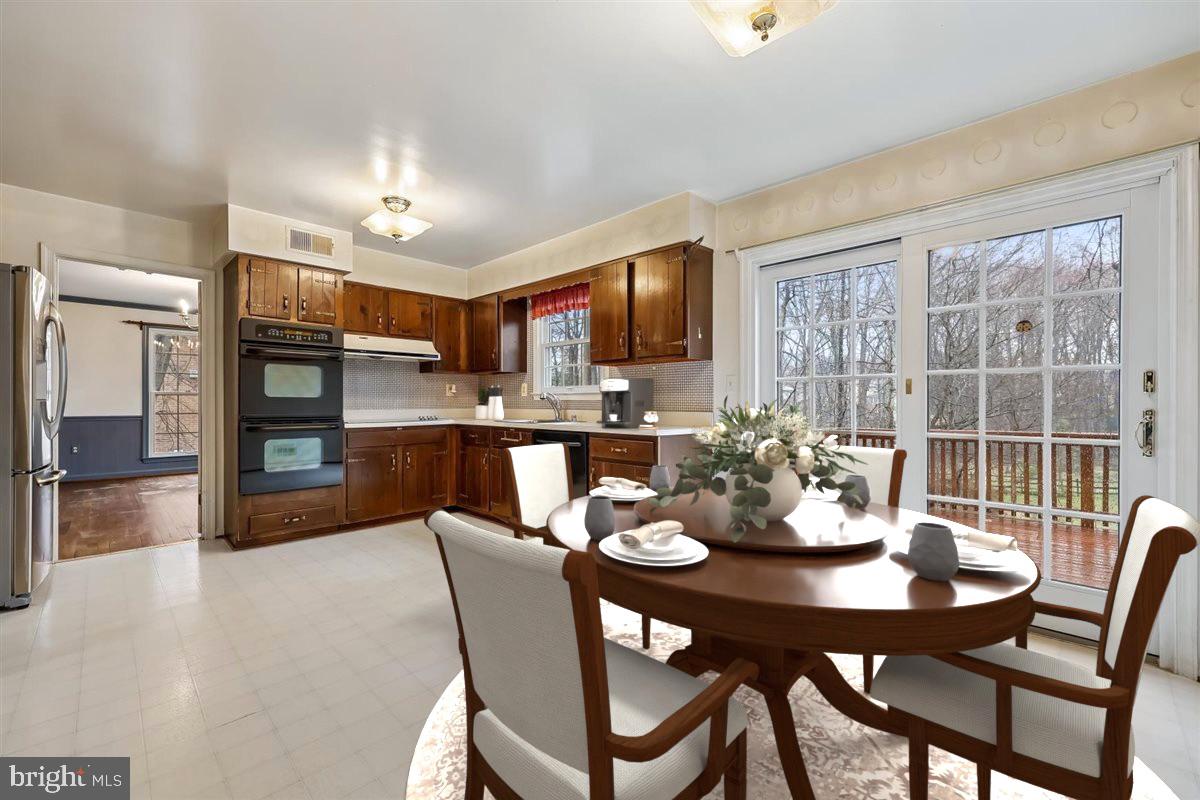 13724 Bridgewater Drive Silver Spring, MD 20904 - Photo 27 of 99 a view of a dining room with furniture