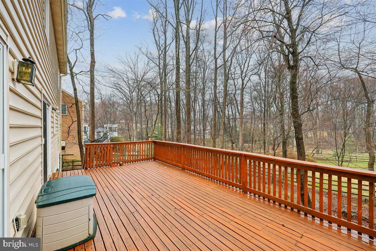 13724 Bridgewater Drive Silver Spring, MD 20904 - Photo 32 of 99 a view of balcony with couch and wooden fence