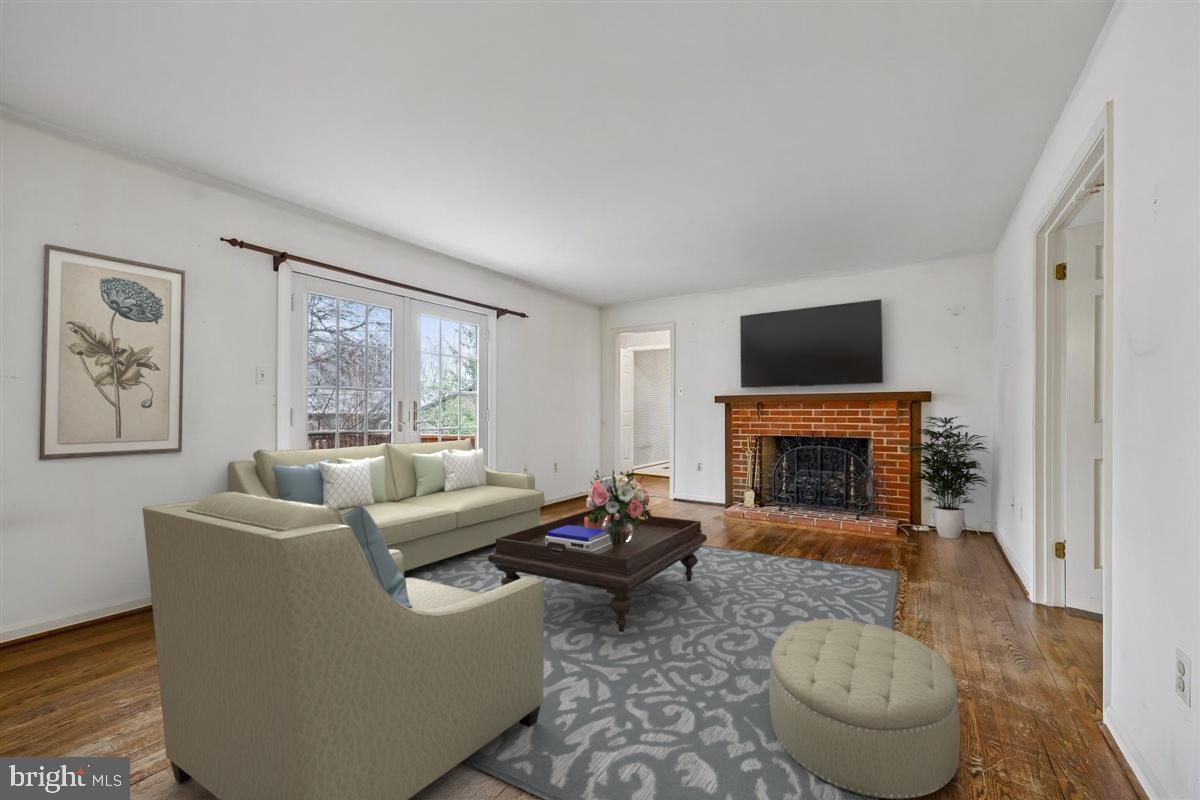 13724 Bridgewater Drive Silver Spring, MD 20904 - Photo 34 of 99 a living room with furniture a rug and a fireplace