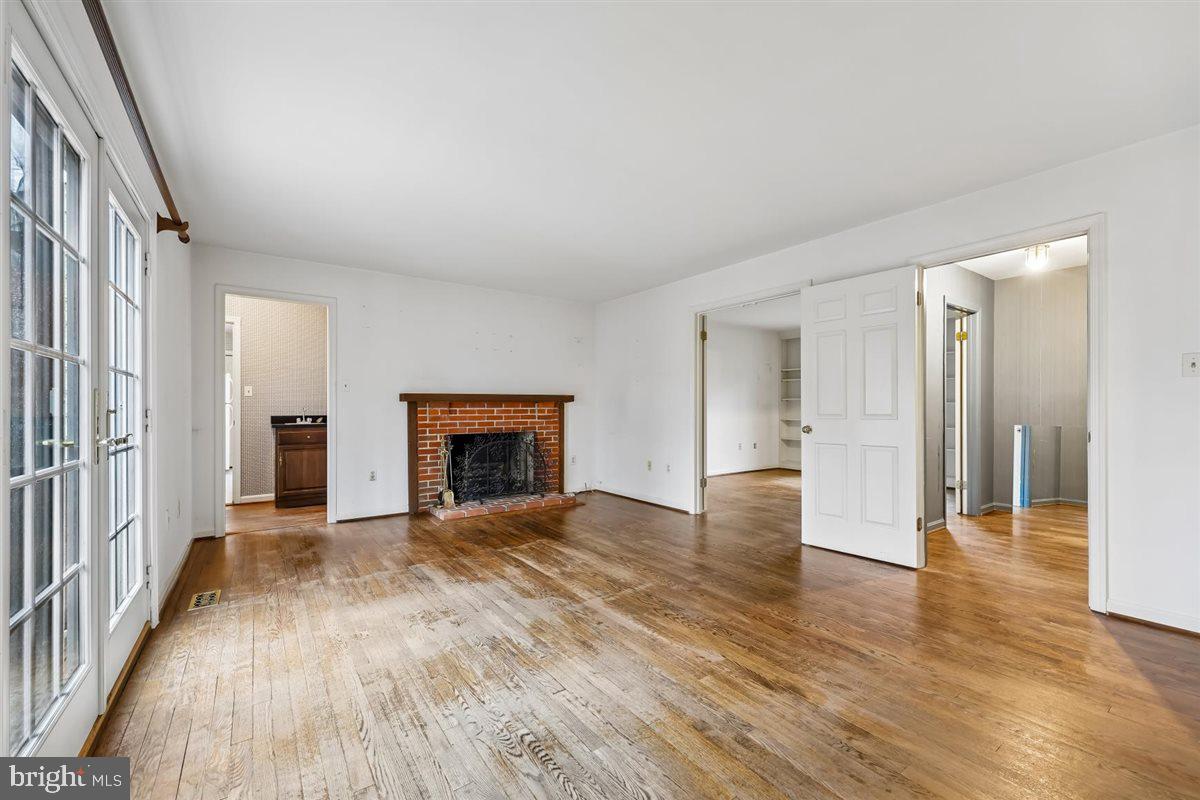 13724 Bridgewater Drive Silver Spring, MD 20904 - Photo 36 of 99 a view of a livingroom with wooden floor and a fireplace