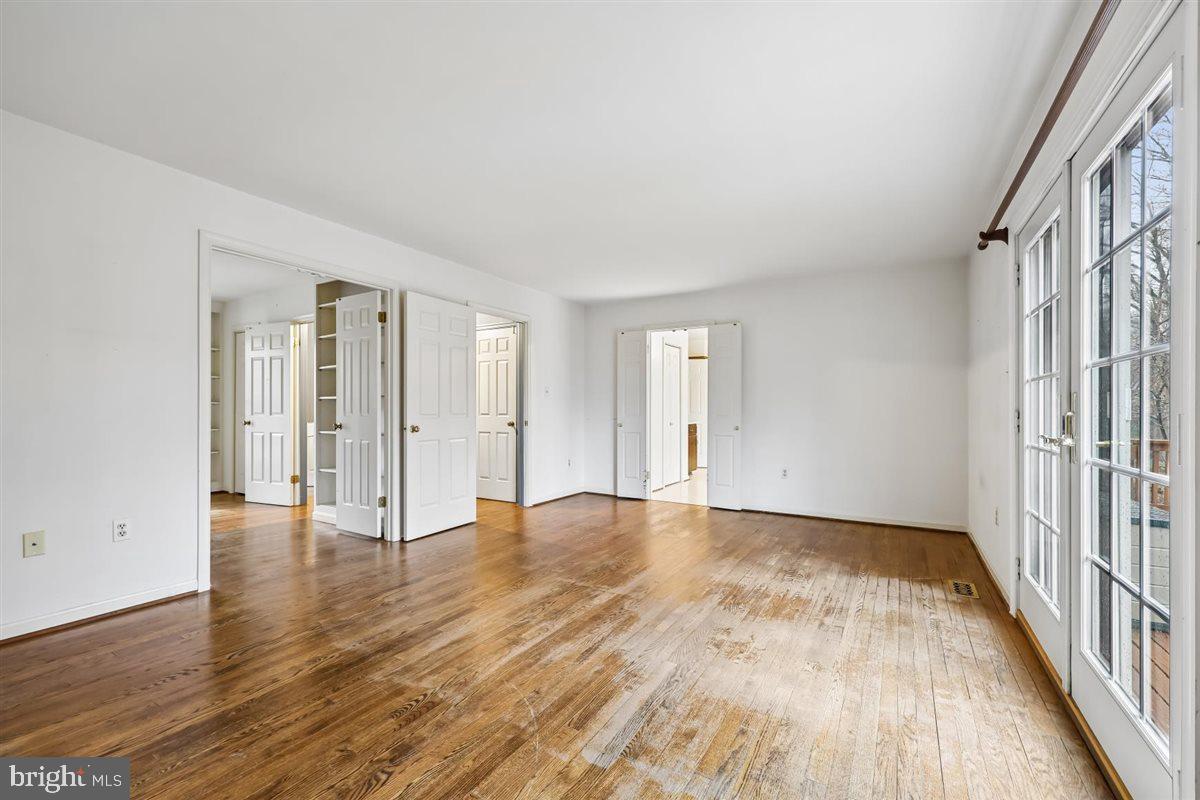 13724 Bridgewater Drive Silver Spring, MD 20904 - Photo 38 of 99 a view of an empty room with wooden floor