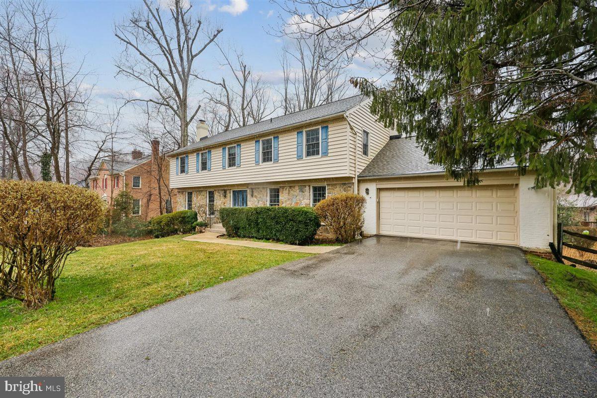 13724 Bridgewater Drive Silver Spring, MD 20904 - Photo 6 of 99 a front view of a house with a yard and garage