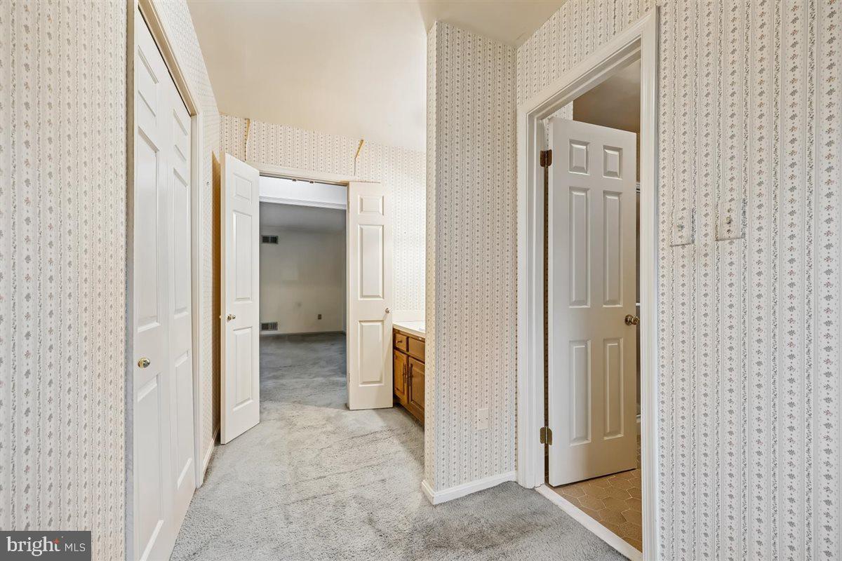 13724 Bridgewater Drive Silver Spring, MD 20904 - Photo 61 of 99 a view of a bathroom from a corridor