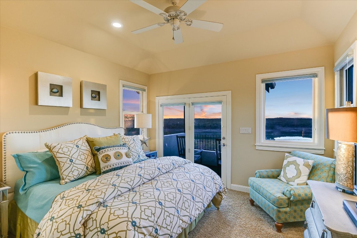 633 Wesley Ridge Drive Spicewood, TX 78669 - Photo 25 of 40 This top-floor bedroom with en-suite bath boasts some of the most commanding views in the home from a private balcony.