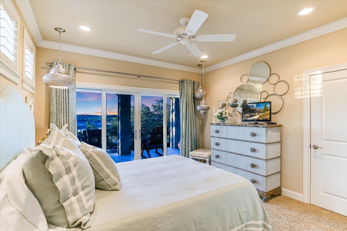633 Wesley Ridge Drive Spicewood, TX 78669 - Photo 34 of 40 This secondary bedroom at the lower level offers direct access to the covered porch.