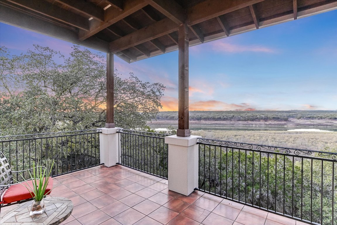 633 Wesley Ridge Drive Spicewood, TX 78669 - Photo 6 of 40 Breathtaking views of Lake Travis and the surrounding Hill Country take center stage.