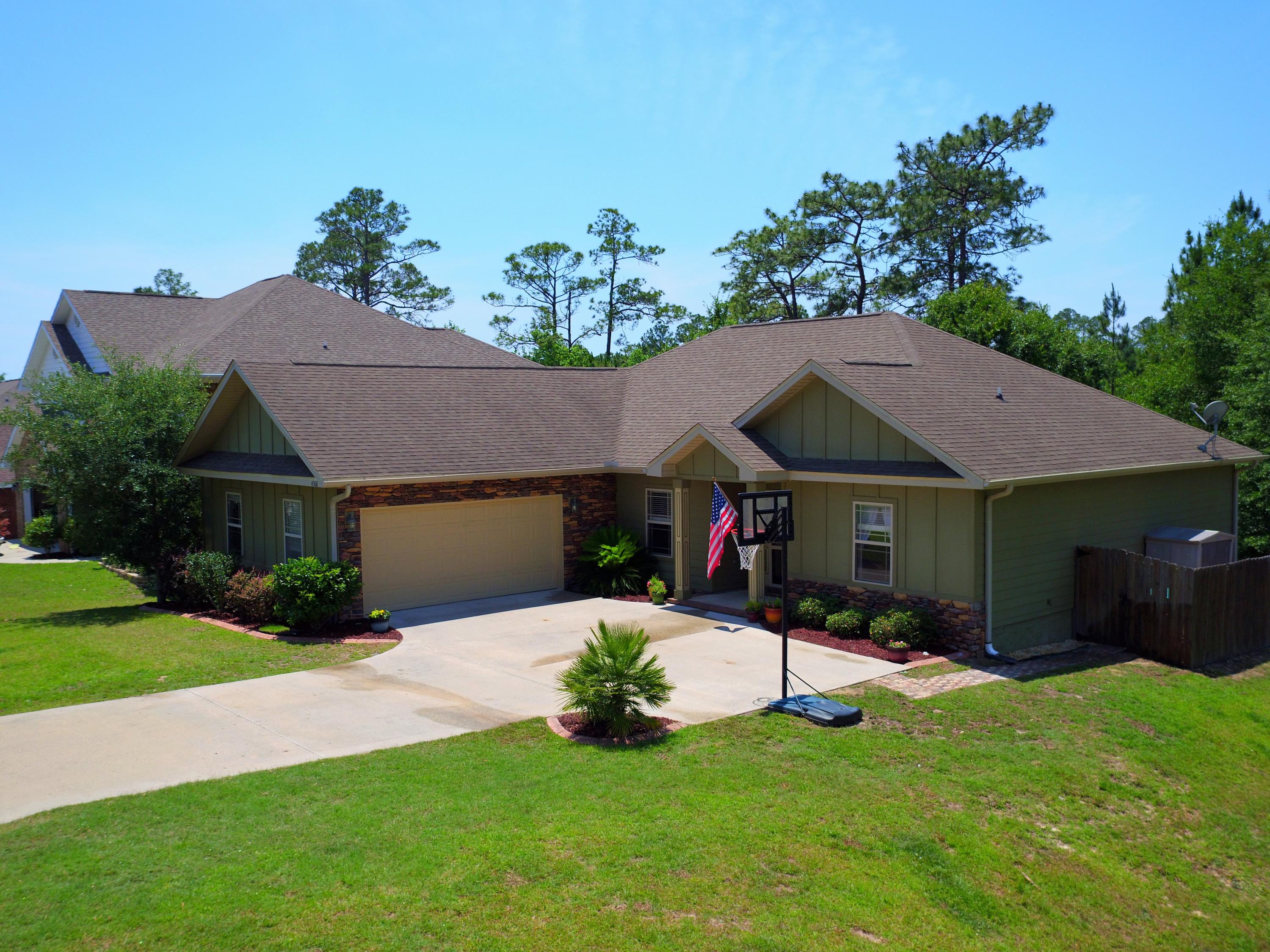 4568 Hermosa Road Crestview, FL 32539 - Photo 1 of 51 a view of a house with a yard and a porch