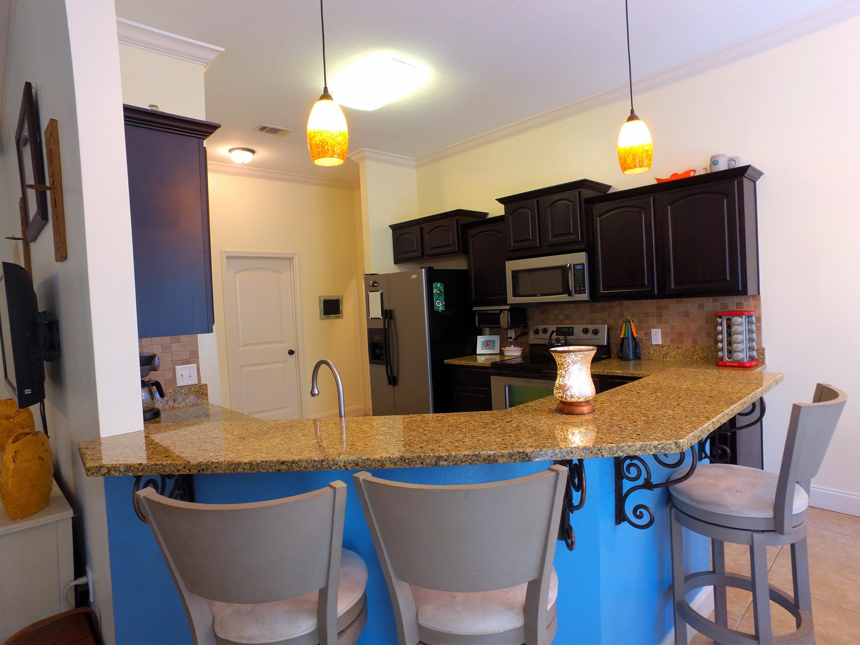 4568 Hermosa Road Crestview, FL 32539 - Photo 14 of 51 a view of a dining room with furniture