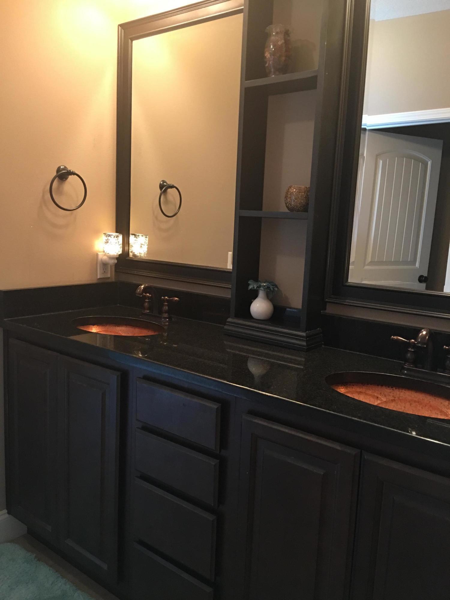 4568 Hermosa Road Crestview, FL 32539 - Photo 20 of 51 a bathroom with a double vanity sink and mirror