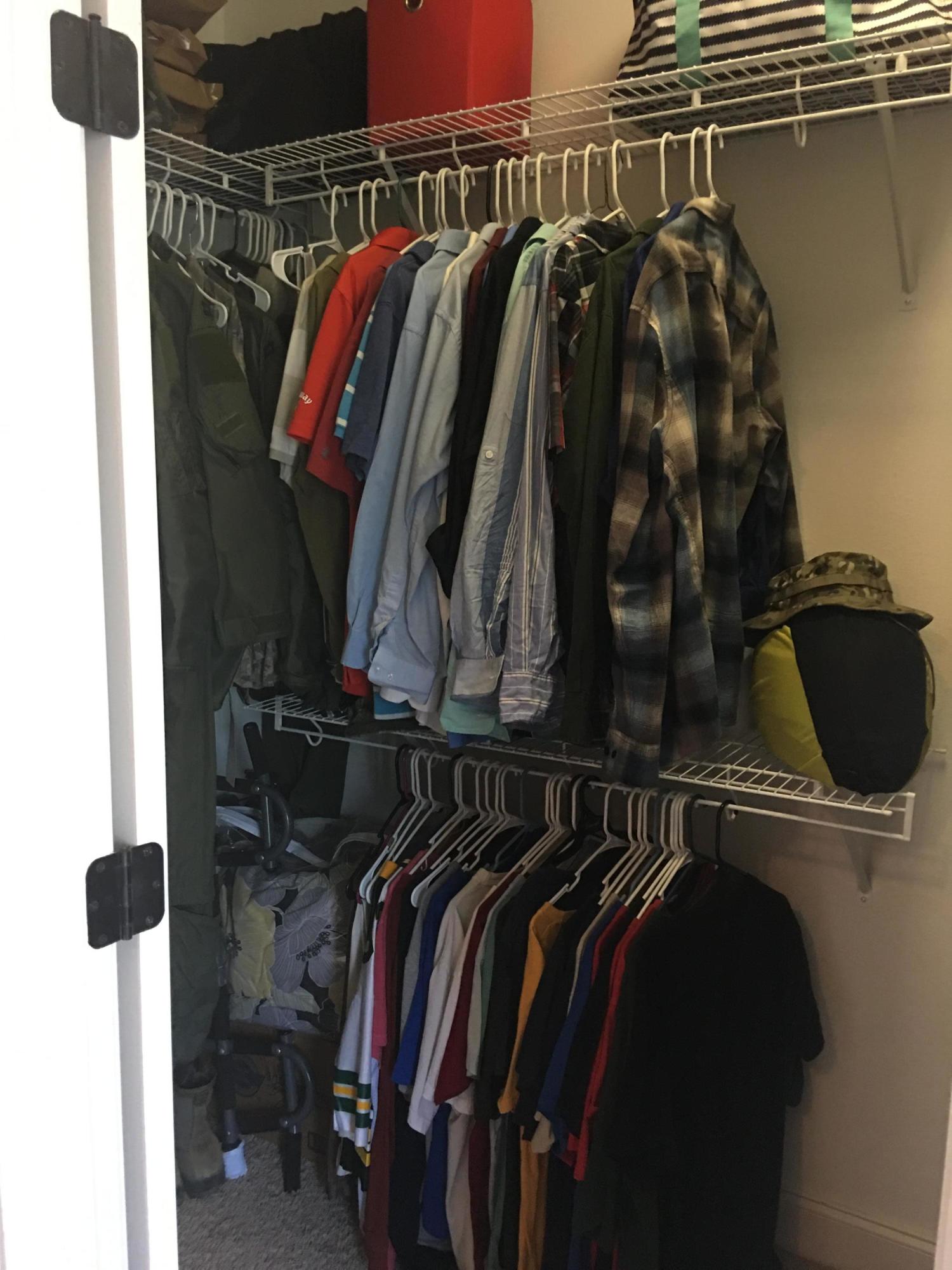 4568 Hermosa Road Crestview, FL 32539 - Photo 25 of 51 a view of walk in closet with clothes and shoes