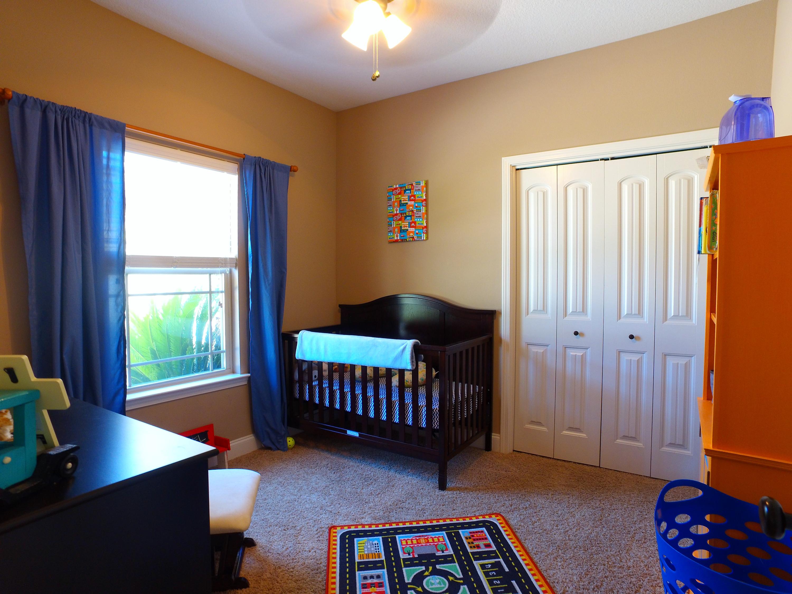 4568 Hermosa Road Crestview, FL 32539 - Photo 26 of 51 a bedroom with furniture and a window