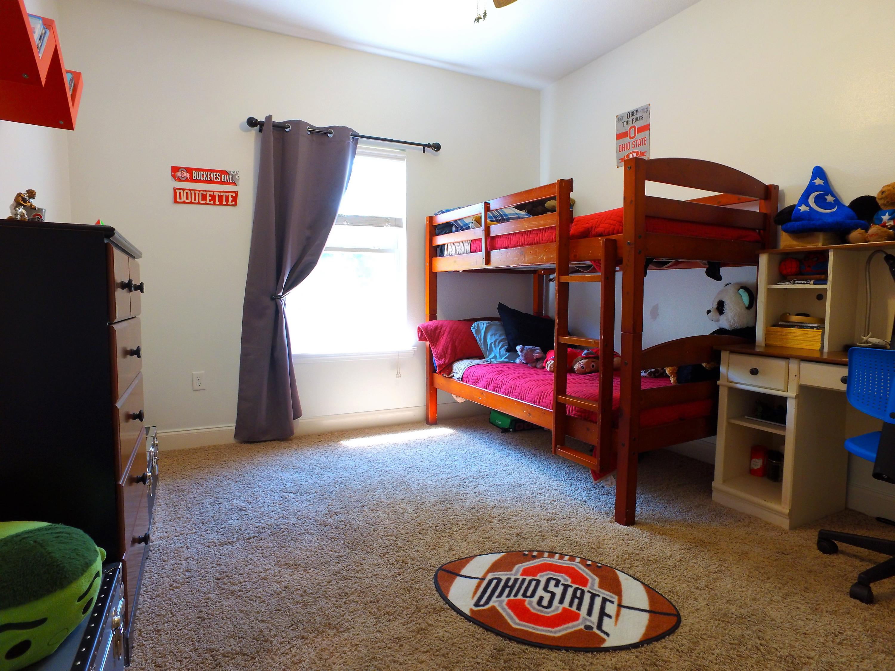 4568 Hermosa Road Crestview, FL 32539 - Photo 31 of 51 a bedroom with furniture and a baby crib