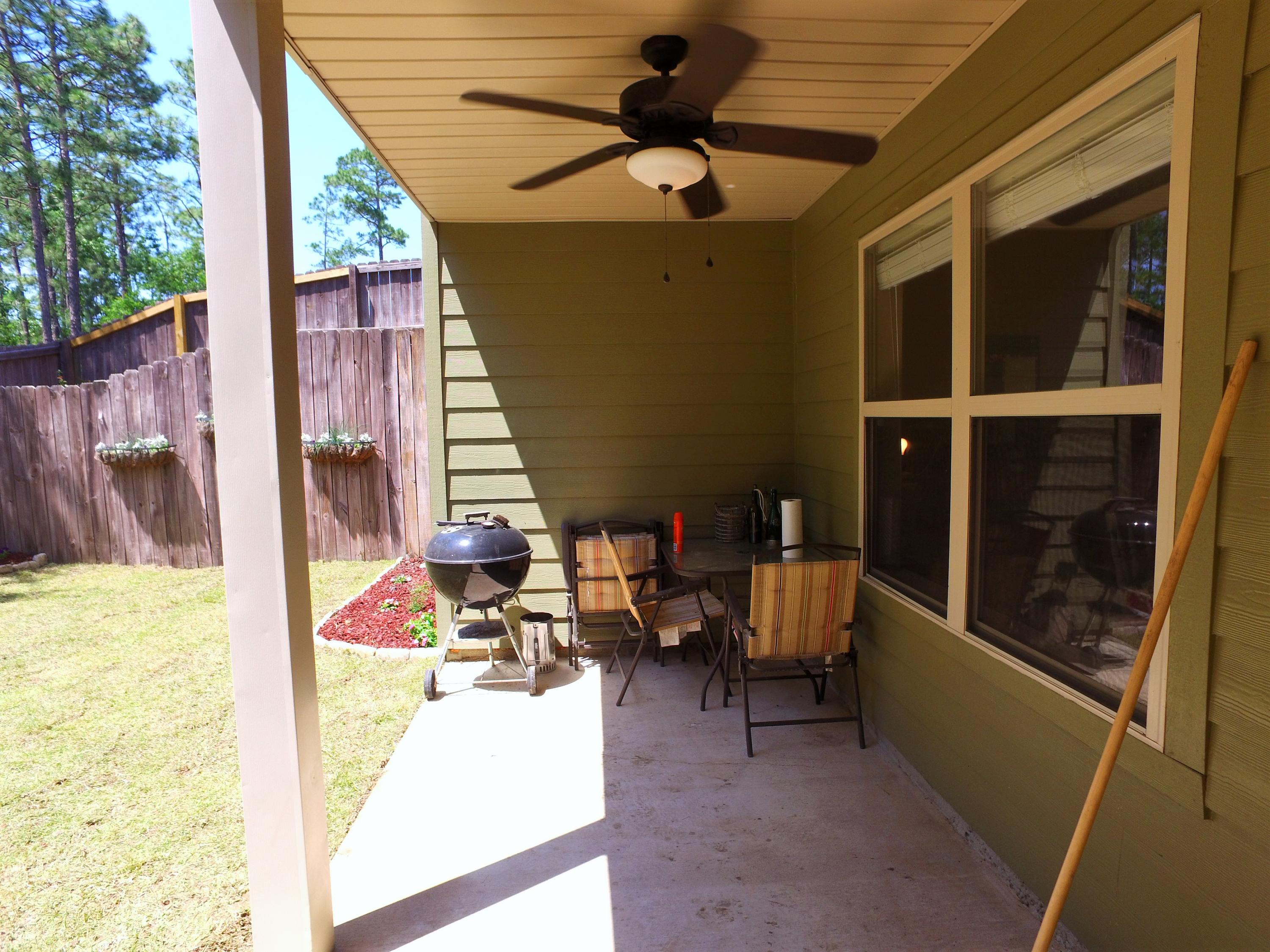 4568 Hermosa Road Crestview, FL 32539 - Photo 41 of 51 a balcony with table and chairs