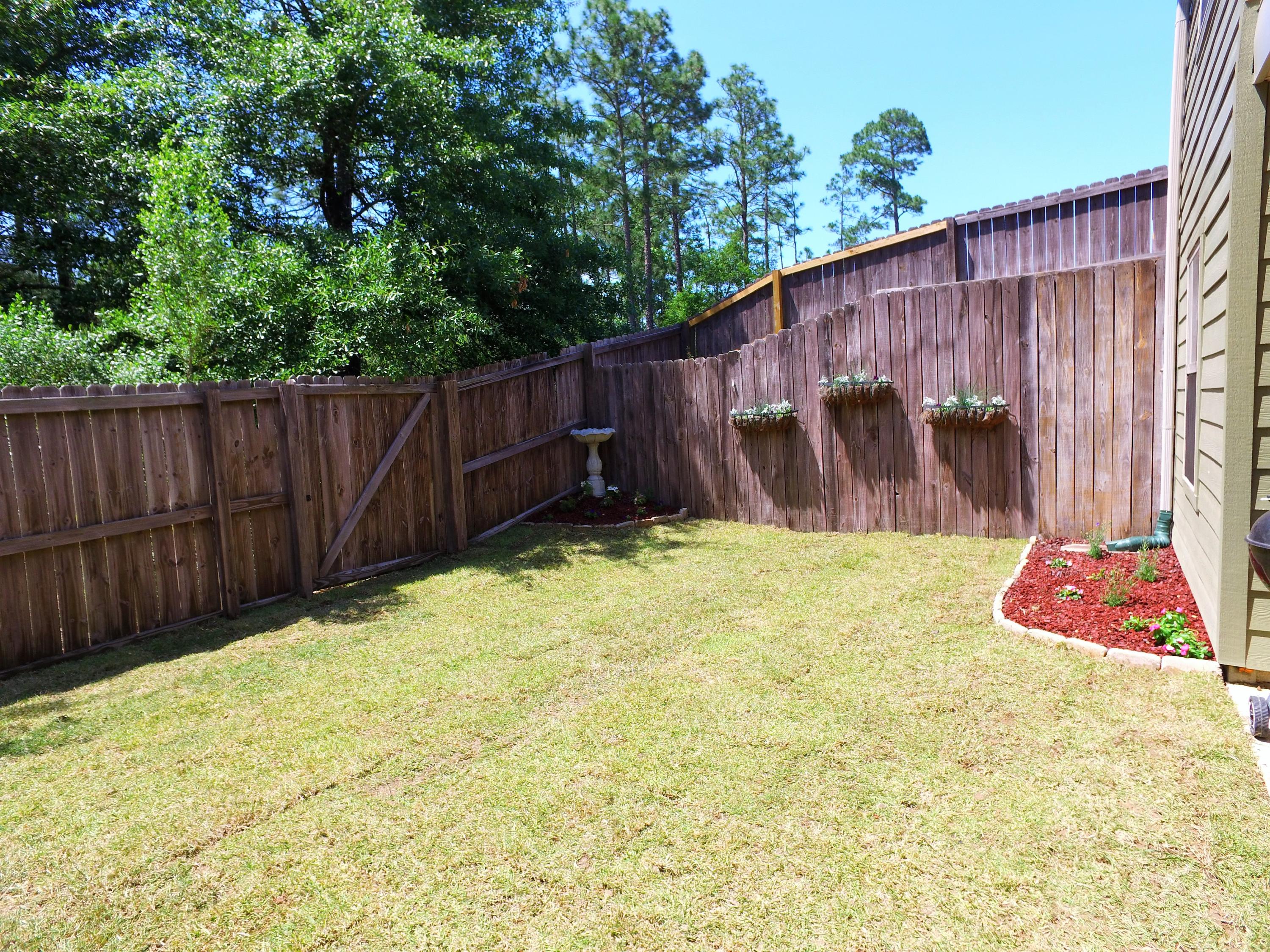 4568 Hermosa Road Crestview, FL 32539 - Photo 42 of 51 a view of a backyard with wooden fence