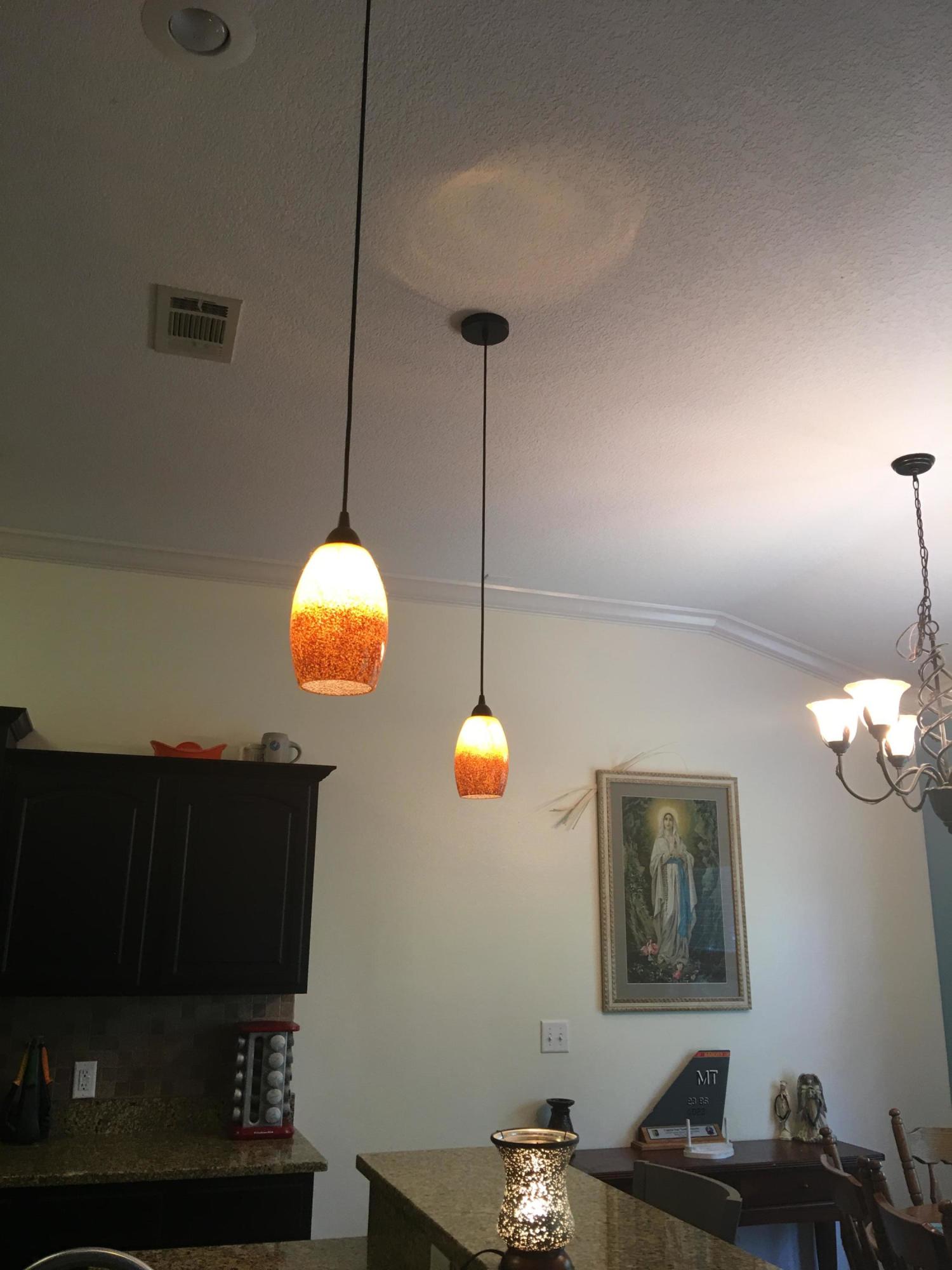 4568 Hermosa Road Crestview, FL 32539 - Photo 47 of 51 a bedroom with a bed and a chandelier