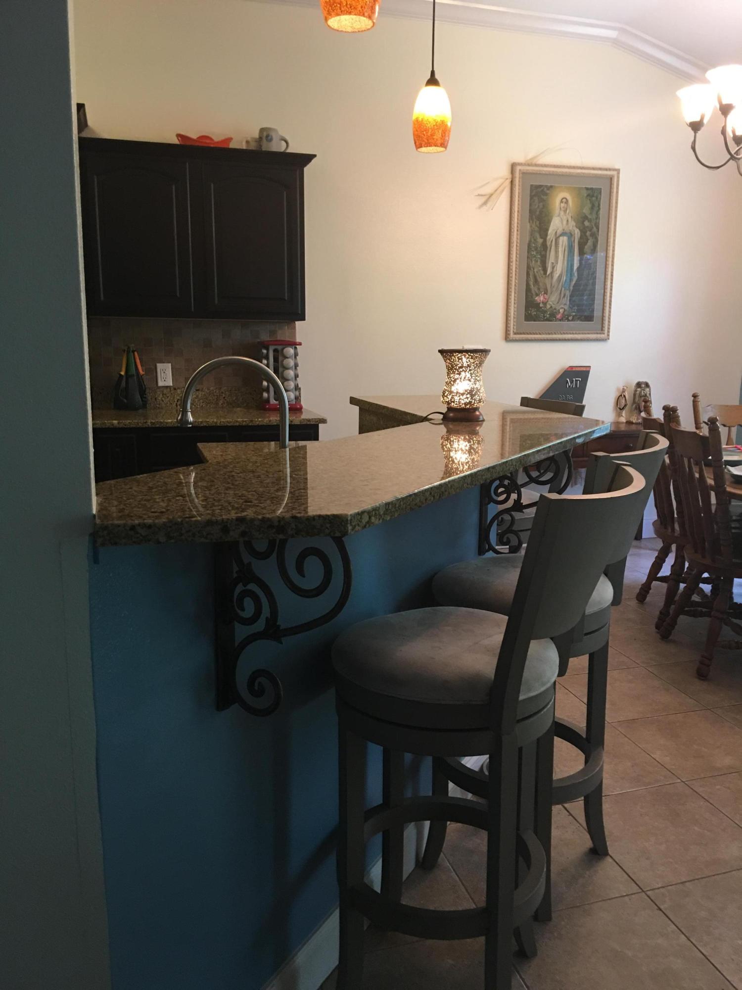 4568 Hermosa Road Crestview, FL 32539 - Photo 48 of 51 a kitchen with a table and chairs in it