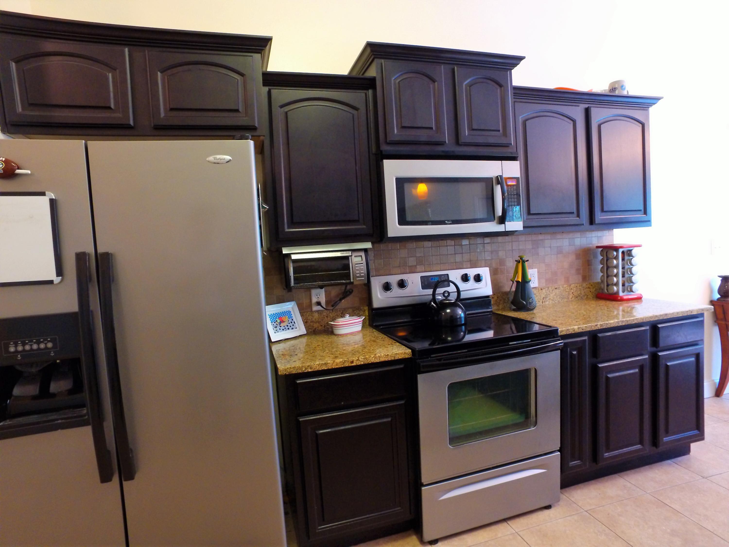 4568 Hermosa Road Crestview, FL 32539 - Photo 8 of 51 a kitchen with stainless steel appliances granite countertop a refrigerator stove and sink