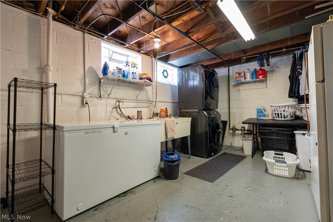 8320 Ackley Road Parma, OH 44129 - Photo 23 of 36 Basement with stacked washer and dryer