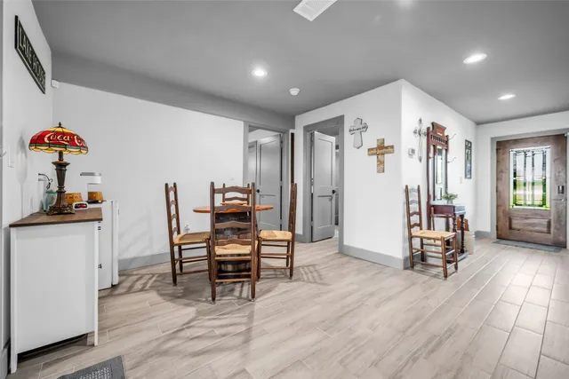 a view of a livingroom with furniture and workspace