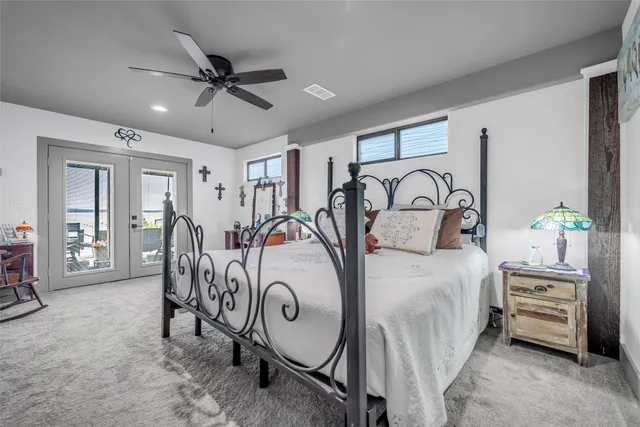 a bedroom with furniture and a chandelier