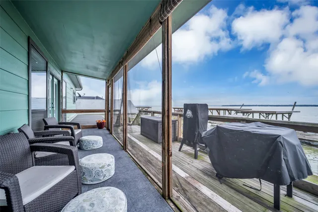 a view of a couches with wooden floor