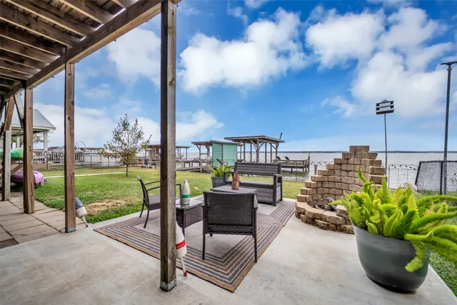 a building outdoor space with patio lots of furniture