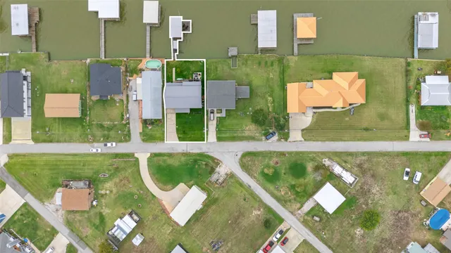an aerial view of a house with pool