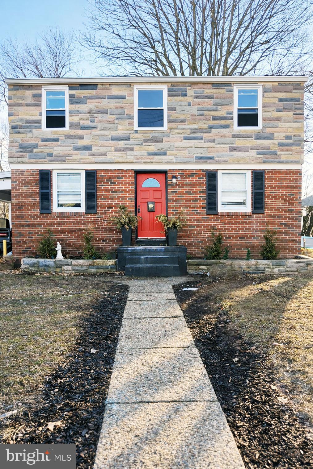 a view of a brick house with many windows