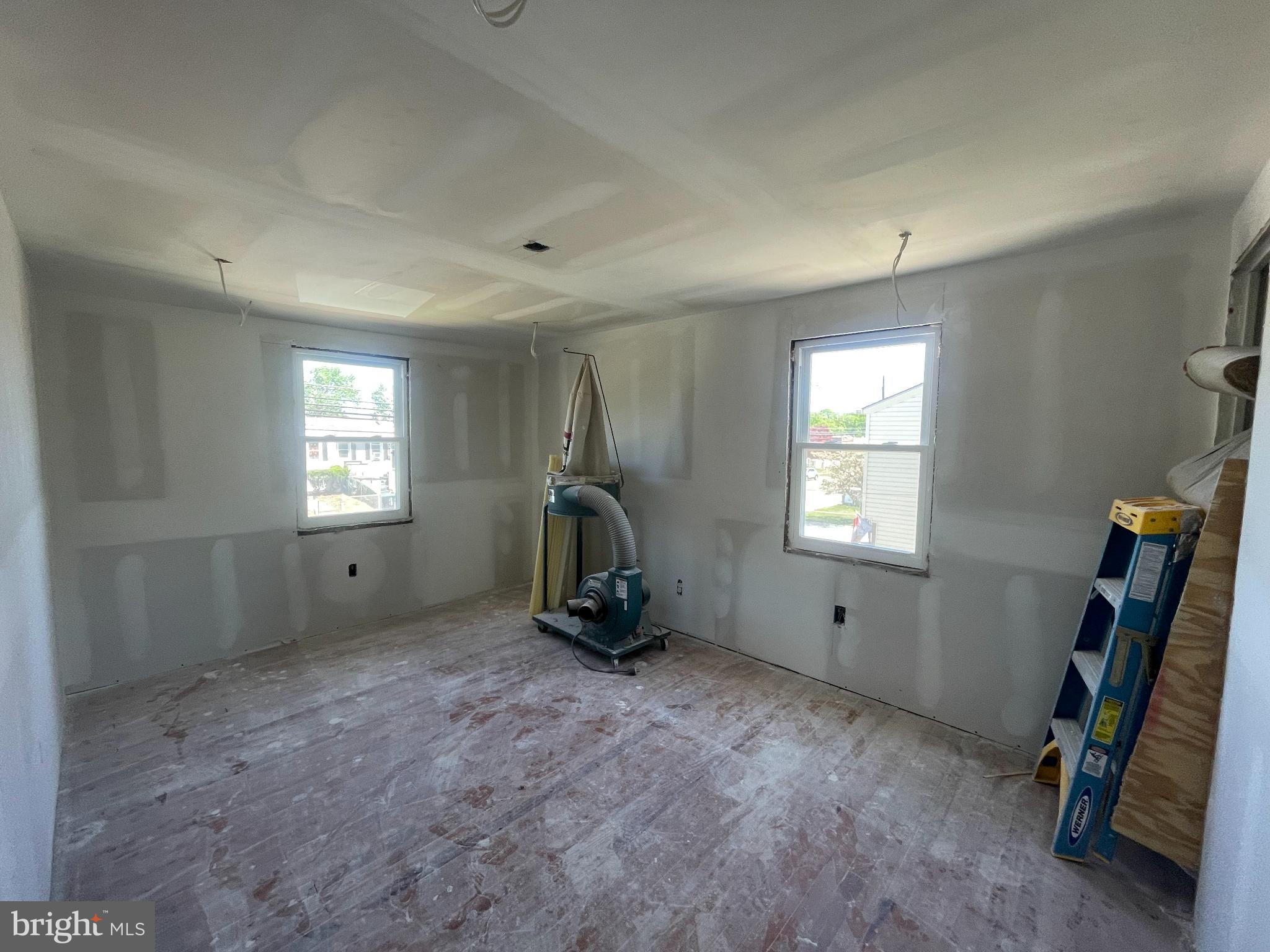 1018 West Browning Road Bellmawr, NJ 08031 - Photo 12 of 15 a view of an empty room with windows
