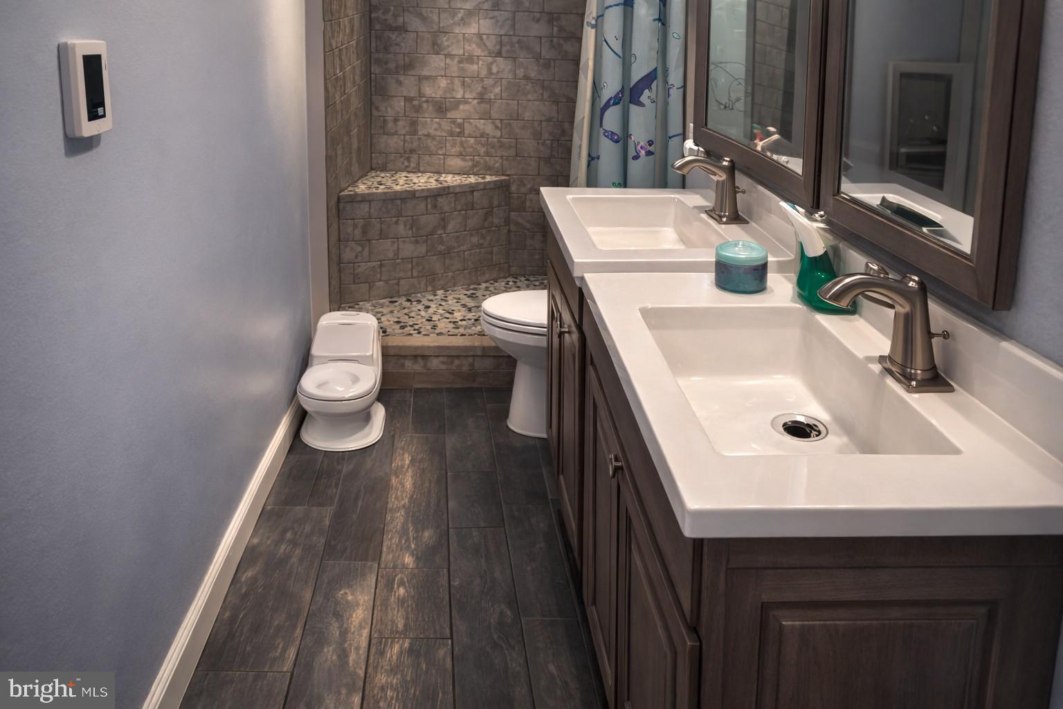 1018 West Browning Road Bellmawr, NJ 08031 - Photo 4 of 15 a bathroom with a sink and a mirror