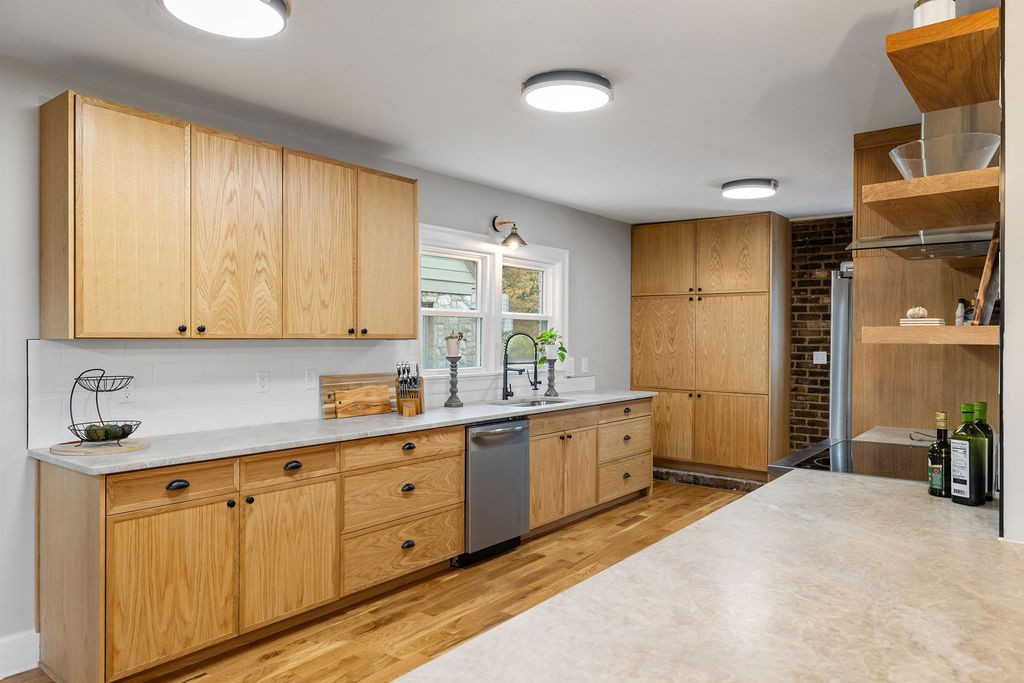 730 East Burton Street Murfreesboro, TN 37130 - Photo 3 of 22 a kitchen with cabinets a sink and a window