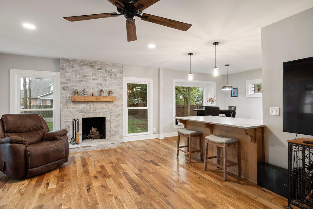 730 East Burton Street Murfreesboro, TN 37130 - Photo 8 of 22 a living room with furniture a fireplace and a flat screen tv