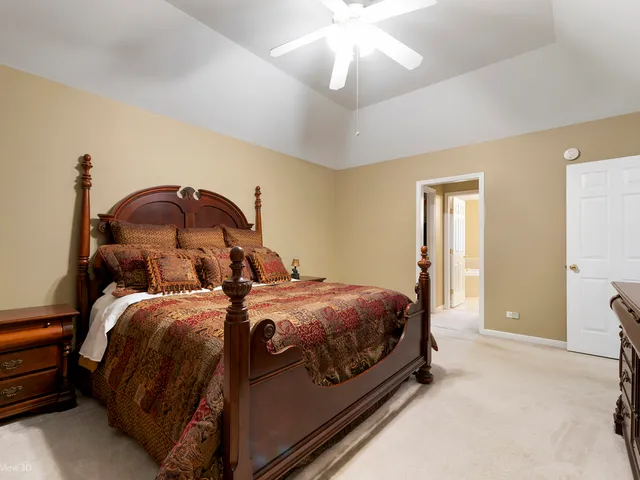 a bed room with two bed and a chandelier