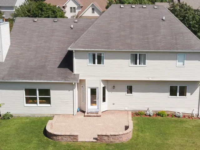 a aerial view of a house with a yard