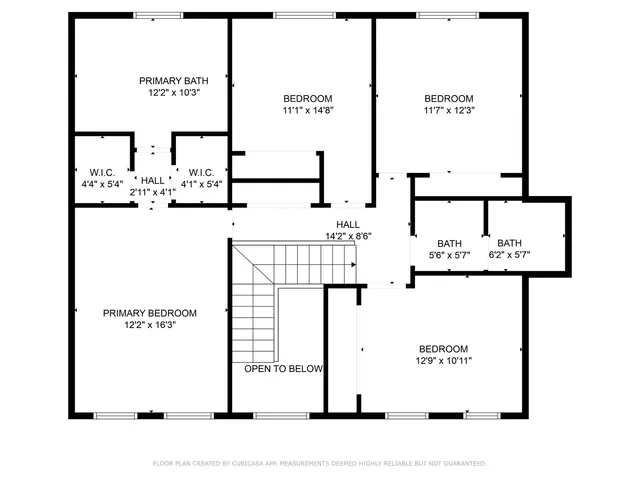 an aerial view of a house with a yard and pool