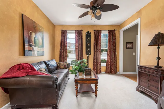 a living room with furniture and a window